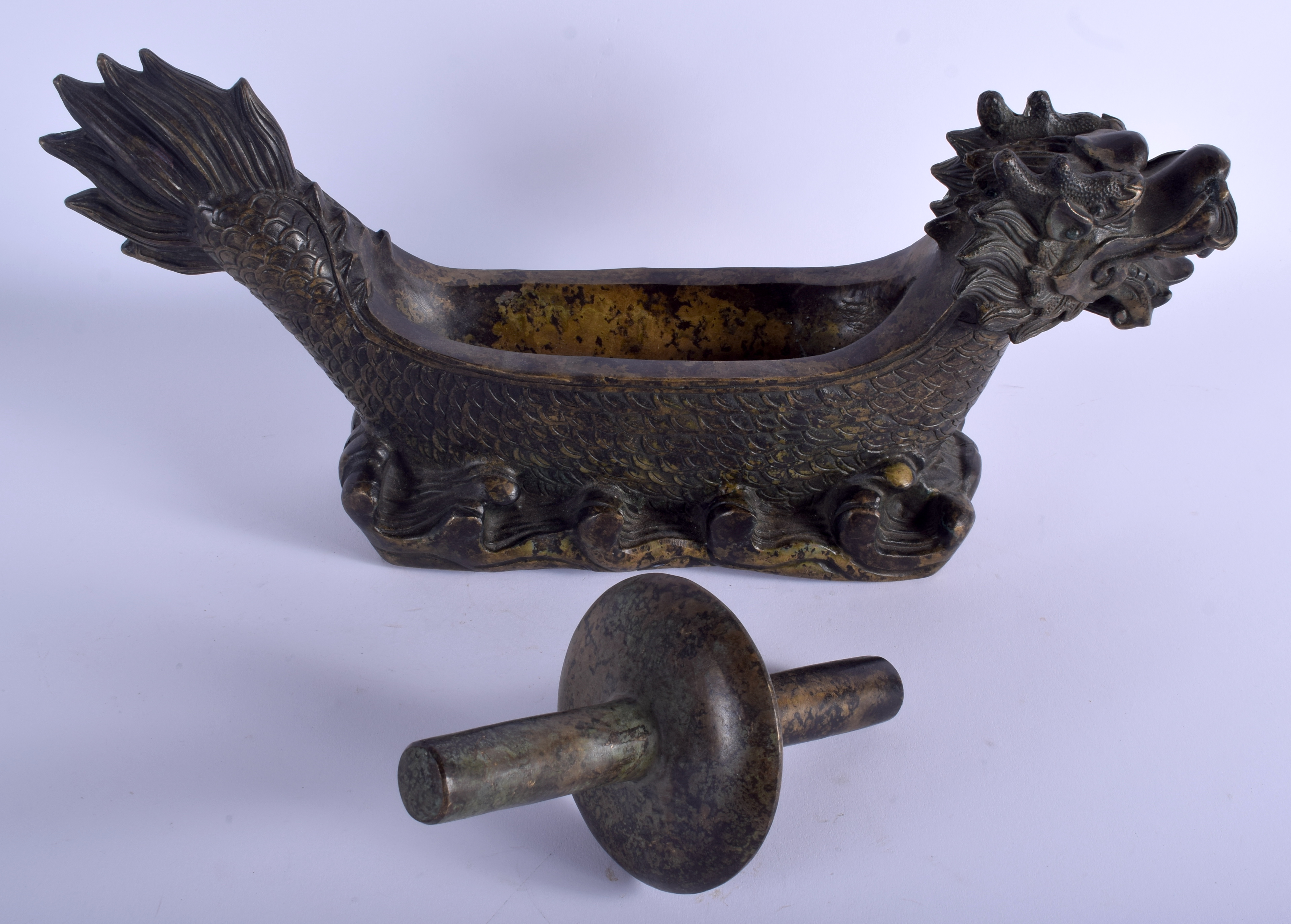 A LARGE CHINESE BRONZE MEDICINE HERB CRUSHER 20th Century, in the form of a dragon. 41 cm x 19 cm.