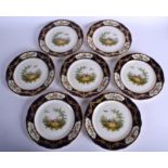 A SET OF SEVEN ANTIQUE AYNSLEY PORCELAIN CABINET PLATES painted with birds and landscapes. 22 cm di