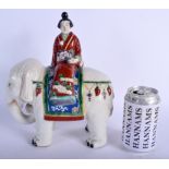 AN UNUSUAL 19TH CENTURY JAPANESE AO KUTANI PORCELAIN FIGURE modelled as a geisha upon an elephant.