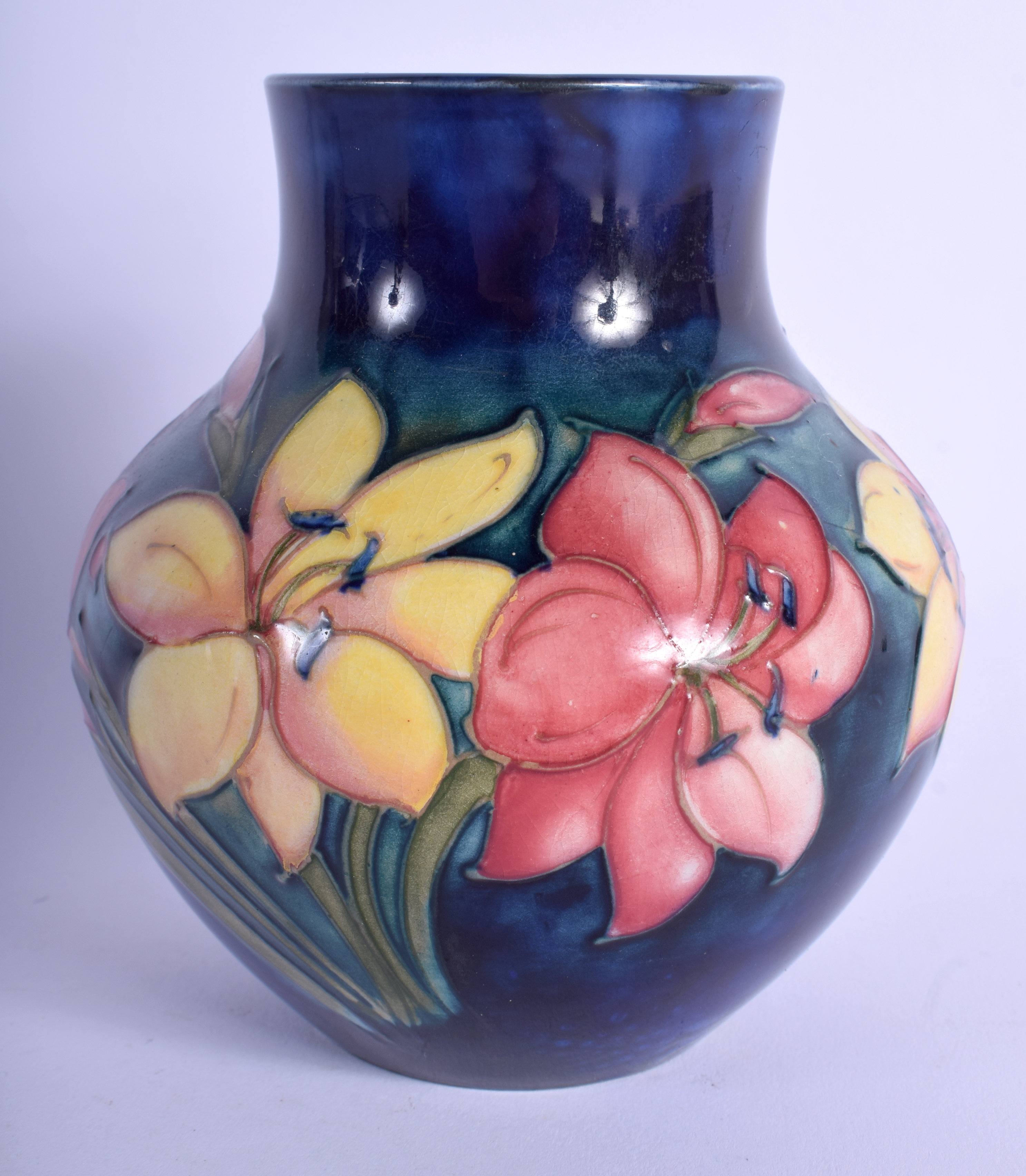 A WILLIAM MOORCROFT VASE painted with foliage. 13.5 cm high.