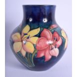 A WILLIAM MOORCROFT VASE painted with foliage. 13.5 cm high.