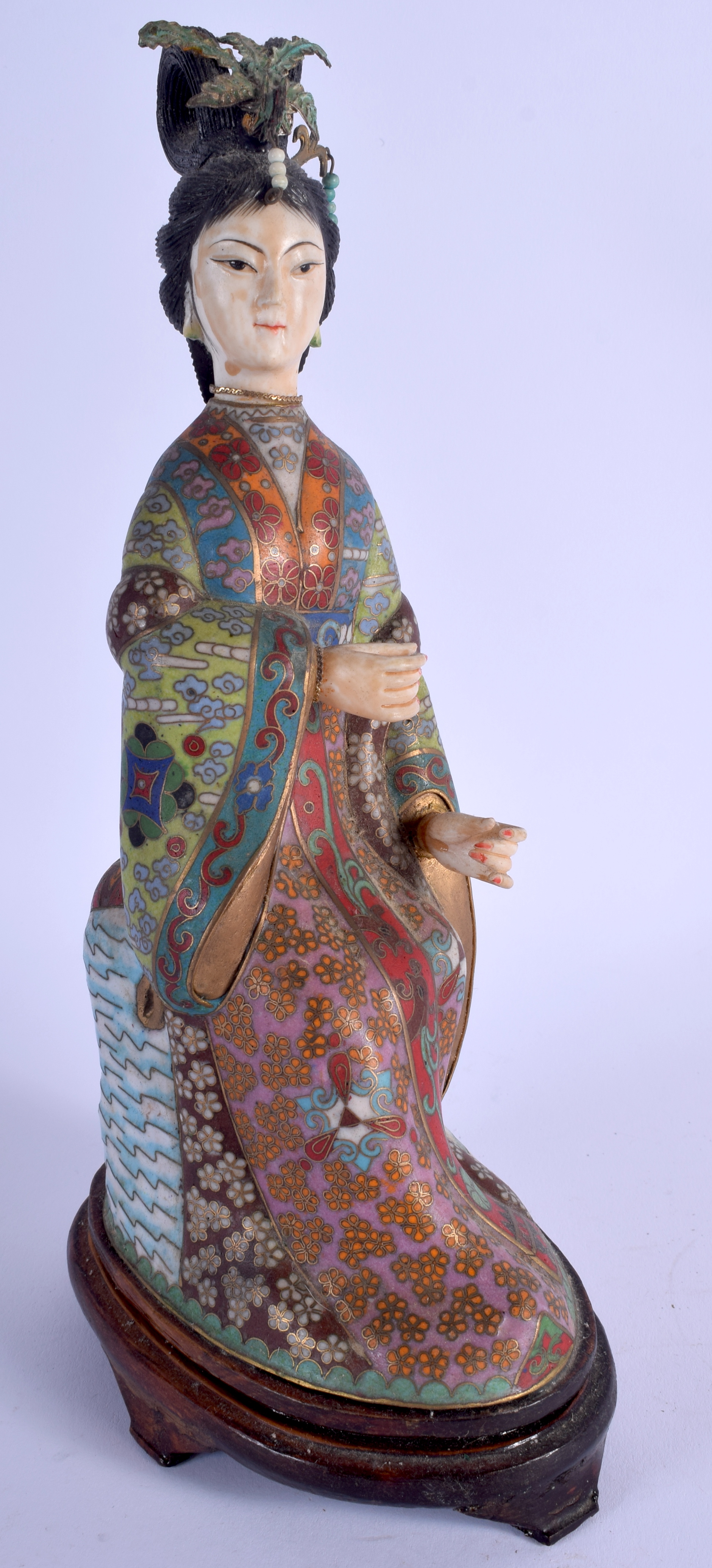 AN EARLY 20TH CENTURY CHINESE CLOISONNE ENAMEL AND IVORY GUANYIN decorated with motifs. 27 cm high.