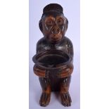 A LOVELY 19TH CENTURY BAVARIAN BLACK FOREST FIGURE OF A MONKEY possibly a smokers compendium. 21 cm