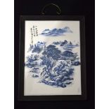 A framed Chinese porcelain plaque