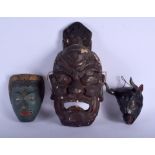A 19TH CENTURY JAPANESE MEIJI PERIOD LACQUERED MASK together with two others. Largest 33 cm x 20 cm