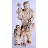 A 19TH CENTURY JAPANESE MEIJI PERIOD CARVED IVORY OKIMONO modelled as male and child. 14 cm high.