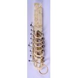 A 19TH CENTURY CHINESE CARVED CANTON IVORY PUZZLE of figural form. 22.5 cm long.