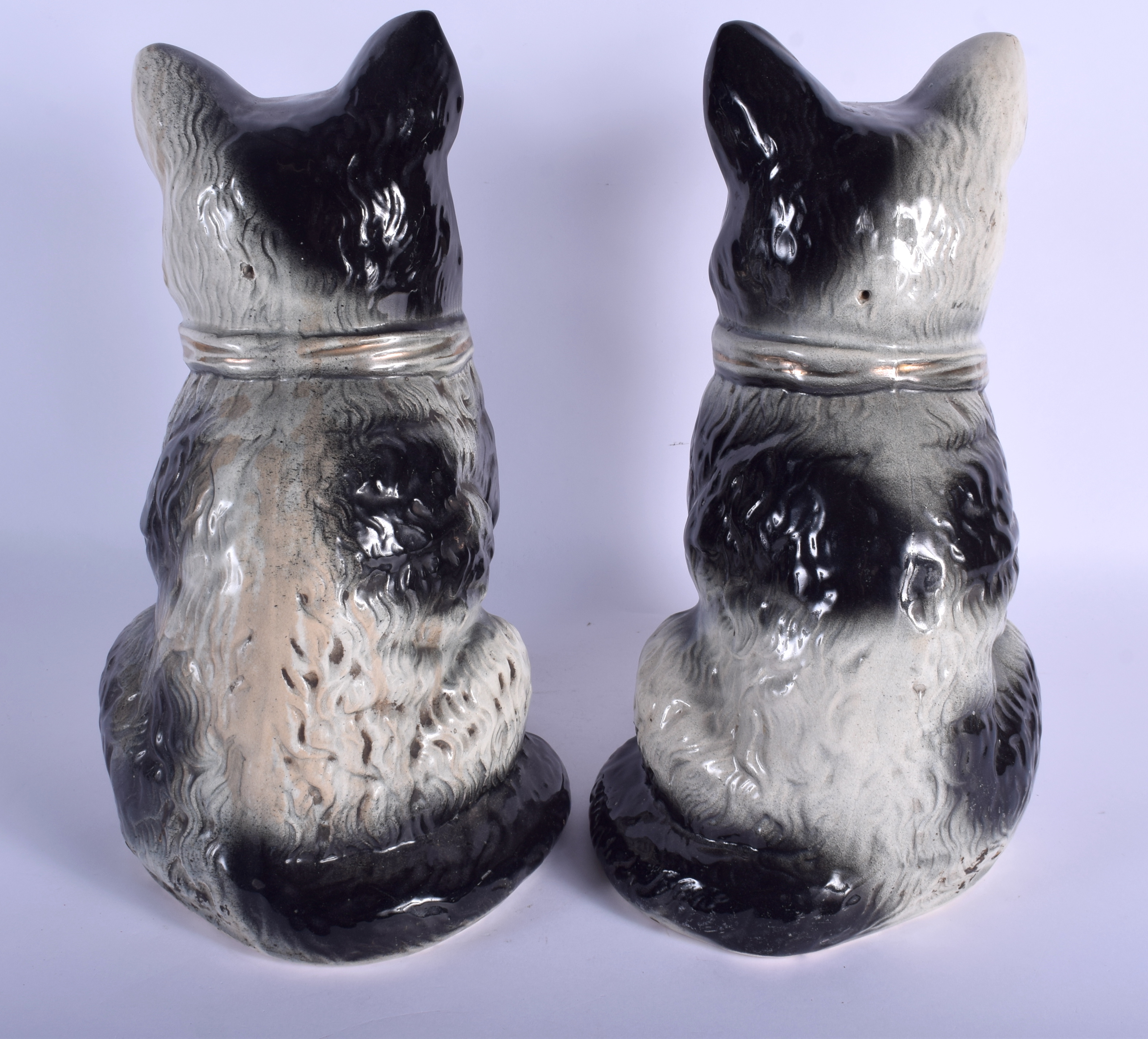 A LARGE PAIR OF 19TH CENTURY CONTINENTAL POTTERY CATS modelled in gilt bow ties. 34 cm high. - Image 2 of 3