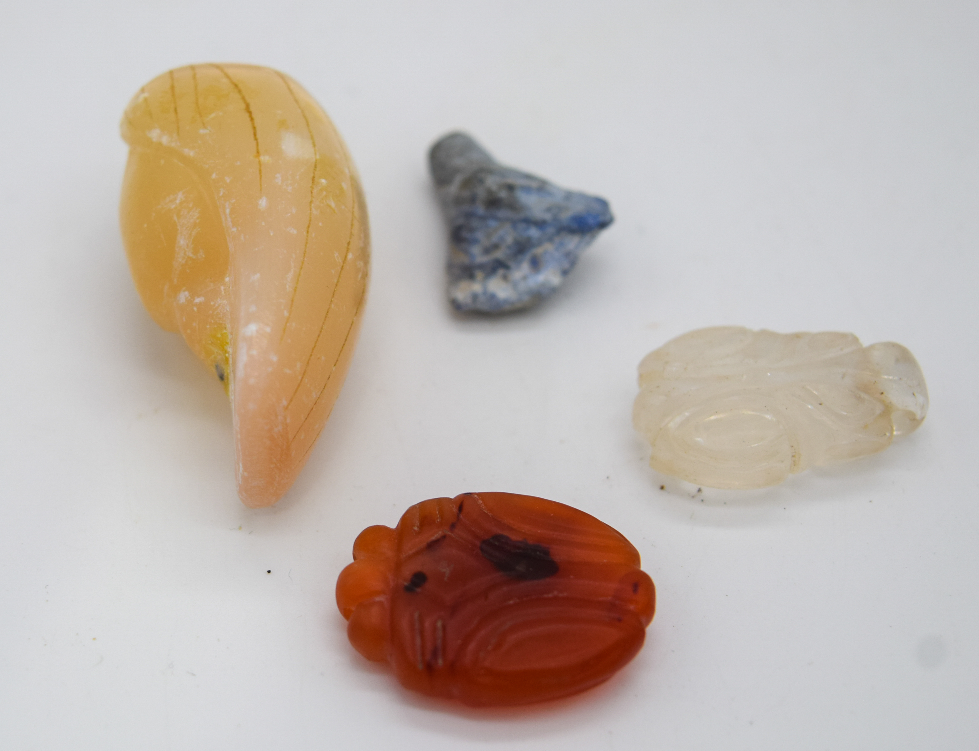 Three small stone pendants and a small carved boulder - Image 2 of 3