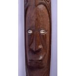 A TRIBAL PAPUA NEW GUINEA SEPIK CARVED WOOD AND CONCH SHELL PLAQUE. 85 cm long.