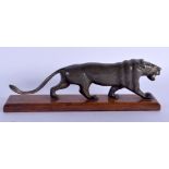 A 19TH CENTURY CONTINENTAL CARVED RHINOCEROS HORN LION modelled upon a plinth. 16 cm wide.