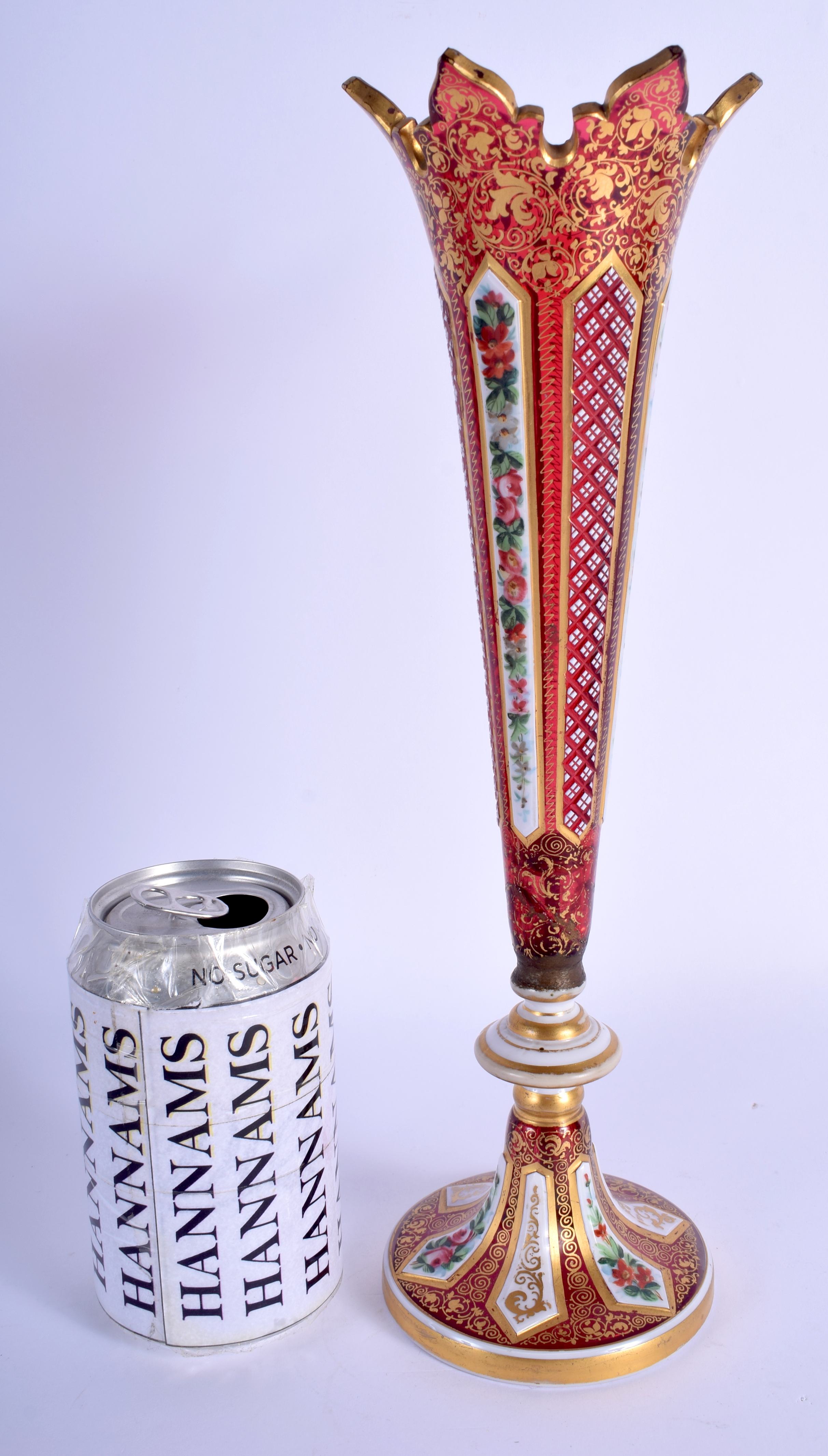 A 19TH CENTURY BOHEMIAN ENAMELLED GLASS VASE painted and jewelled with foliage. 31 cm high.