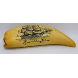 A piece of scrimshaw etched with a sailing boat
