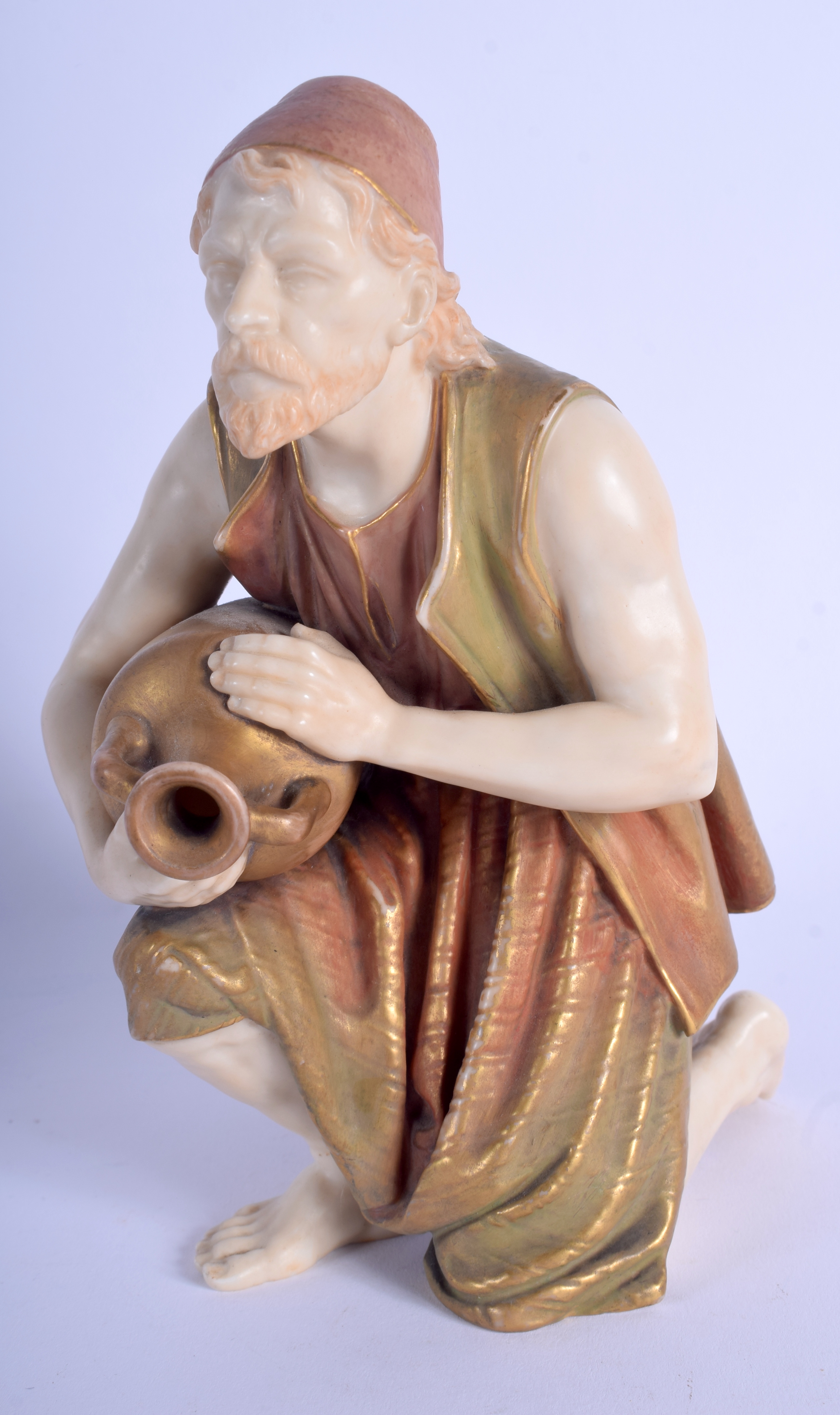 A RARE 19TH CENTURY ROYAL WORCESTER BLUSH IVORY FIGURE modelled as a male pouring a water vessel. 1