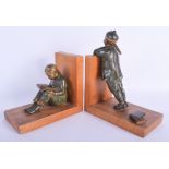 A LOVELY PAIR OF FRENCH PATINATED BRONZE BOOK ENDS modelled as a standing male and seated female. 2
