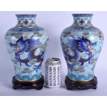 A LARGE PAIR OF CHINESE CLOISONNE ENAMEL VASES 20th Century, decorated with dragons and clouds. Vas