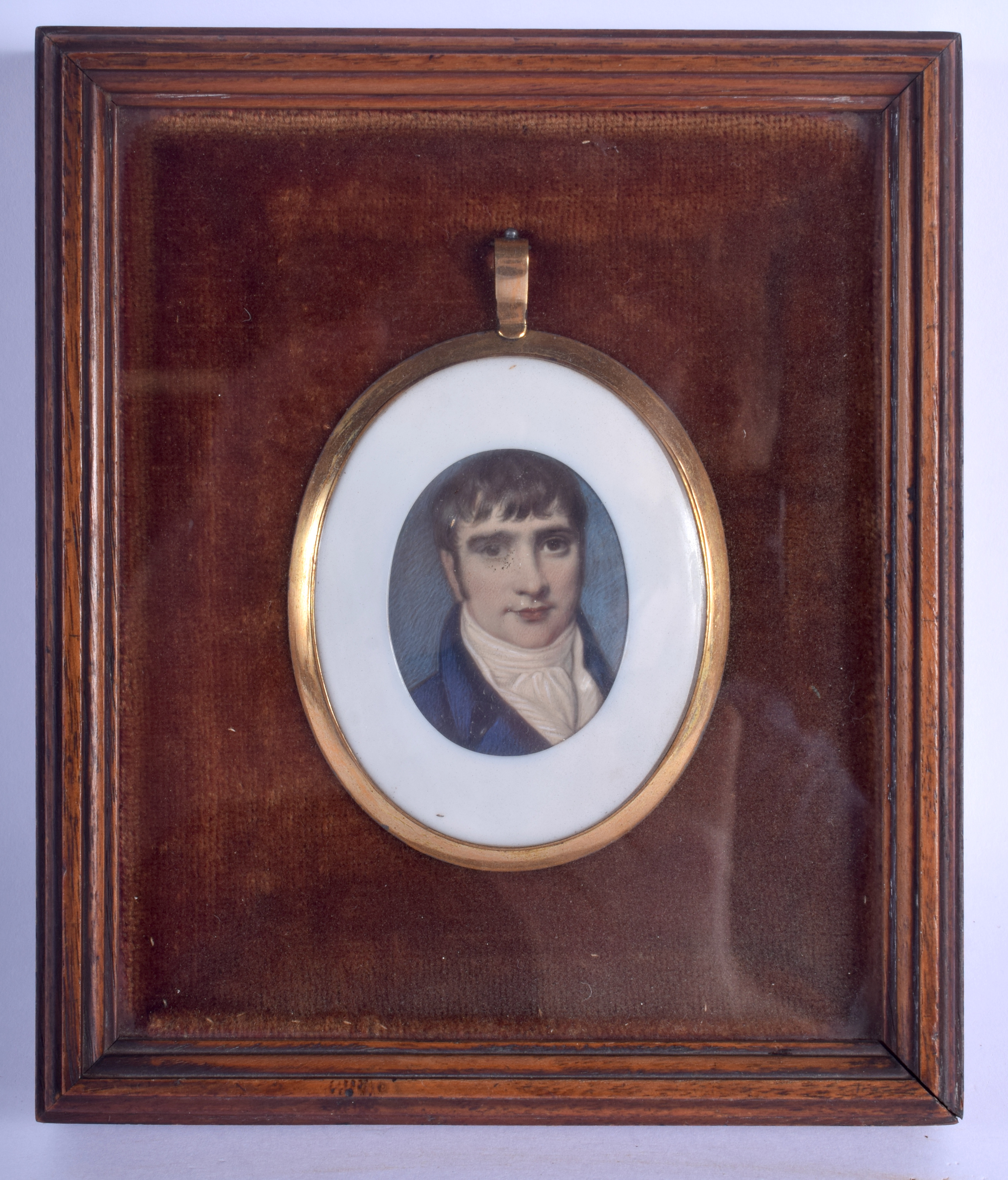 A LOVELY EARLY 19TH CENTURY YELLOW METAL CASED IVORY PORTRAIT MINIATURE depicting a handsome male i