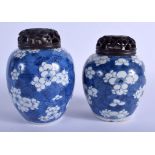 A NEAR PAIR OF 17TH CENTURY CHINESE BLUE AND WHITE GINGER JARS Kangxi, painted with prunus and flow
