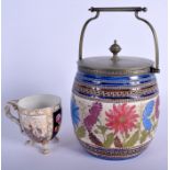 A VICTORIAN AESTHETIC MOVEMENT BISCUIT BARREL together with a Meissen style cup. 23 cm high inc han