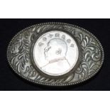 A Chinese white metal belt buckle with a mounted medallion 8.5 cm