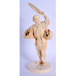 A 19TH CENTURY JAPANESE MEIJI PERIOD TOKYO SCHOOL IVORY OKIMONO modelled as a male holding aloft a