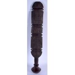 A LARGE 19TH CENTURY EUROPEAN CARVED WOOD TREEN BEATING PADDLE decorated with motifs. 62 cm long.