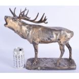A LARGE ANTIQUE SILVERED BRASS FIGURE OF A ROAMING STAG modelled upon a rectangular base. 33 cm x 3