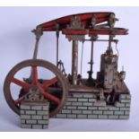 A LOVELY ANTIQUE CAST IRON PAINTED STEAM ENGINE MODEL upon a fitted painted imitation brick wooden
