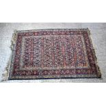 A Turkman red ground rug. 190cm x 140cm