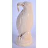 A FINE 19TH CENTURY EUROPEAN CARVED IVORY FIGURE OF A BIRD modelled holding a worm within its mouth