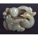 AN EARLY 20TH CENTURY CHINESE CARVED GREEN JADE BOY AND BIRD Late Qing/Republic. 6.5 cm x 5.5 cm.