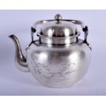 AN EARLY 20TH CENTURY JAPANESE MEIJI PERIOD SILVER TEAPOT AND COVER decorated with landscapes. 268
