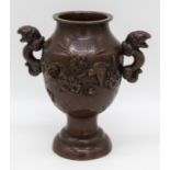 A small Japanese bronze vase decorated with raised birds and flowers 10.5 cm