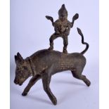 AN EARLY 20TH CENTURY THAI BRONZE FIGURE OF A BUDDHA modelled riding upon a bull. 17 cm x 19 cm.