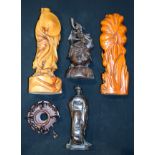 A collection of Oriental wooden statues and a hard wood stand