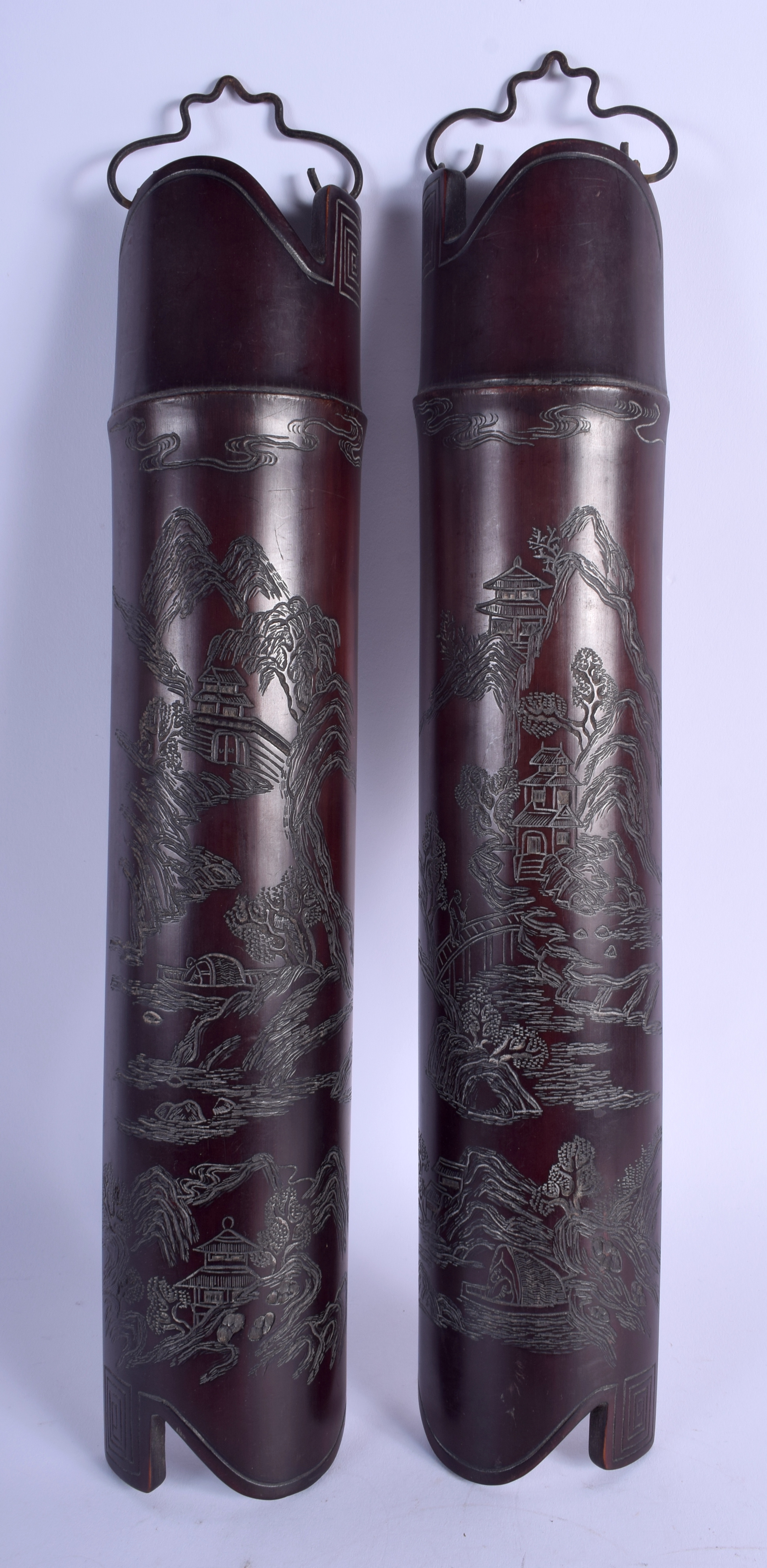 A PAIR OF 19TH CENTURY JAPANESE MEIJI PERIOD CARVED BAMBOO WRIST RESTS decorated with mountainous l