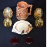 A group of oriental eggs, pottery tankard etc