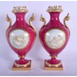 19th c. Coalport pair of vases painted en-grisaille with cherubs in Chelsea style on a crimson gro