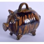 A 19TH CENTURY STAFFORDSHIRE TREACLE GLAZED WHIELDON TYPE MONEY BOX in the form of a pig. 13.5 cm w