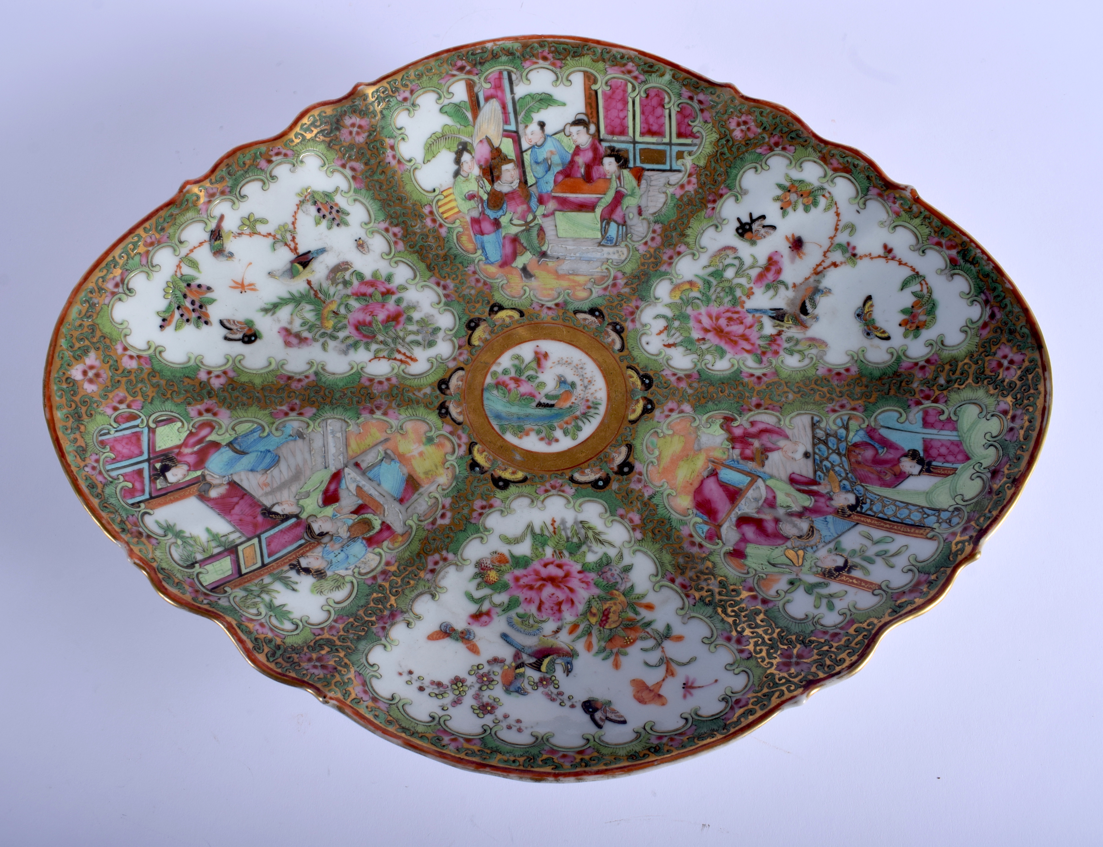 A LARGE 19TH CENTURY CHINESE CANTON FAMILLE ROSE LOBED DISH painted with figures and landscapes. 38