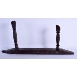 AN UNUSUAL EARLY 20TH CENTURY TRIBAL CARVED WOOD WEAPON REST decorated with angular motifs. 66 cm x