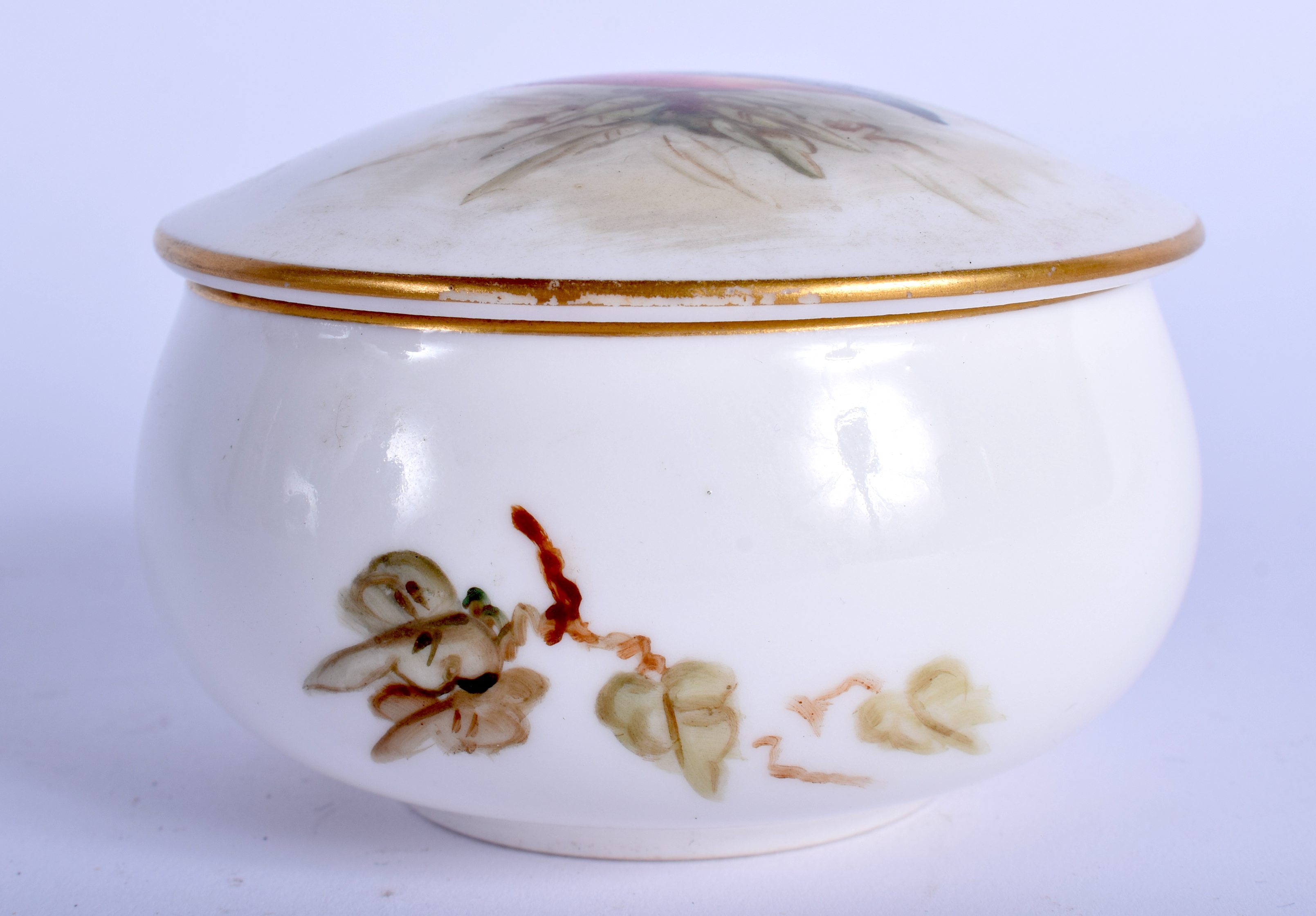 A ROYAL WORCESTER PORCELAIN BOX AND COVER painted with a bird. 8 cm wide.