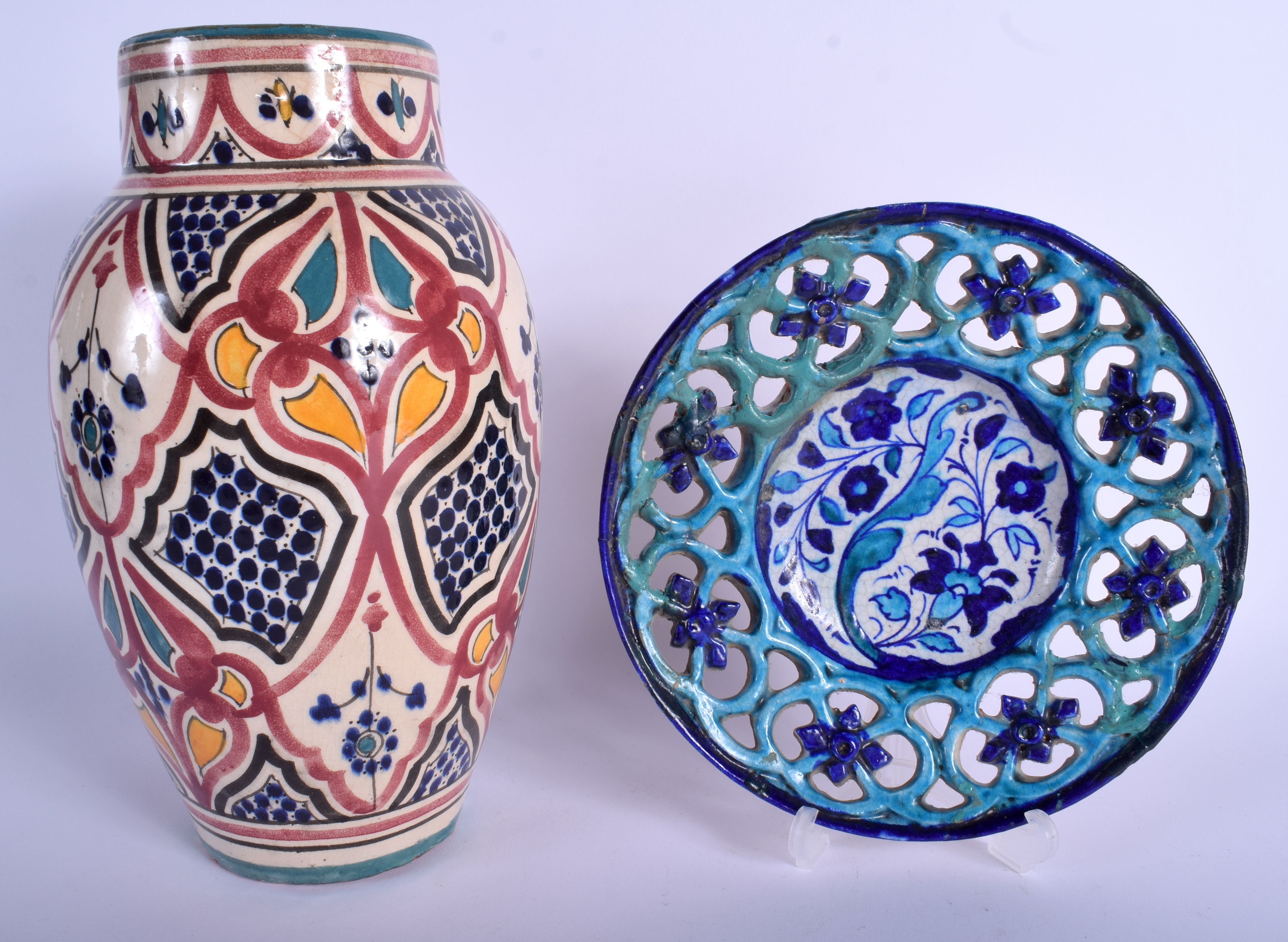 A MIDDLE EASTERN IZNIK FAIENCE TYPE POTTERY VASE together with a similar open work dish. Largest 30