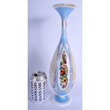 AN ANTIQUE BOHEMIAN BLUE AND ENAMELLED OPALINE GLASS VASE painted with flowers. 36 cm high.