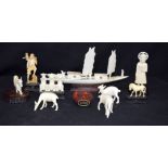 Group of ivory figures and a Cinnabar snuff bottle