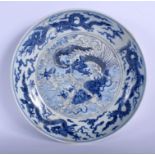 AN 18TH CENTURY CHINESE BLUE AND WHITE PORCELAIN DISH Qing, bearing Xuande marks to rim, painted wi