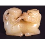 AN EARLY 20TH CENTURY CHINESE CARVED YELLOWISH HADE BEAST Late Qing/Republic. 4 cm x 3.25 cm.