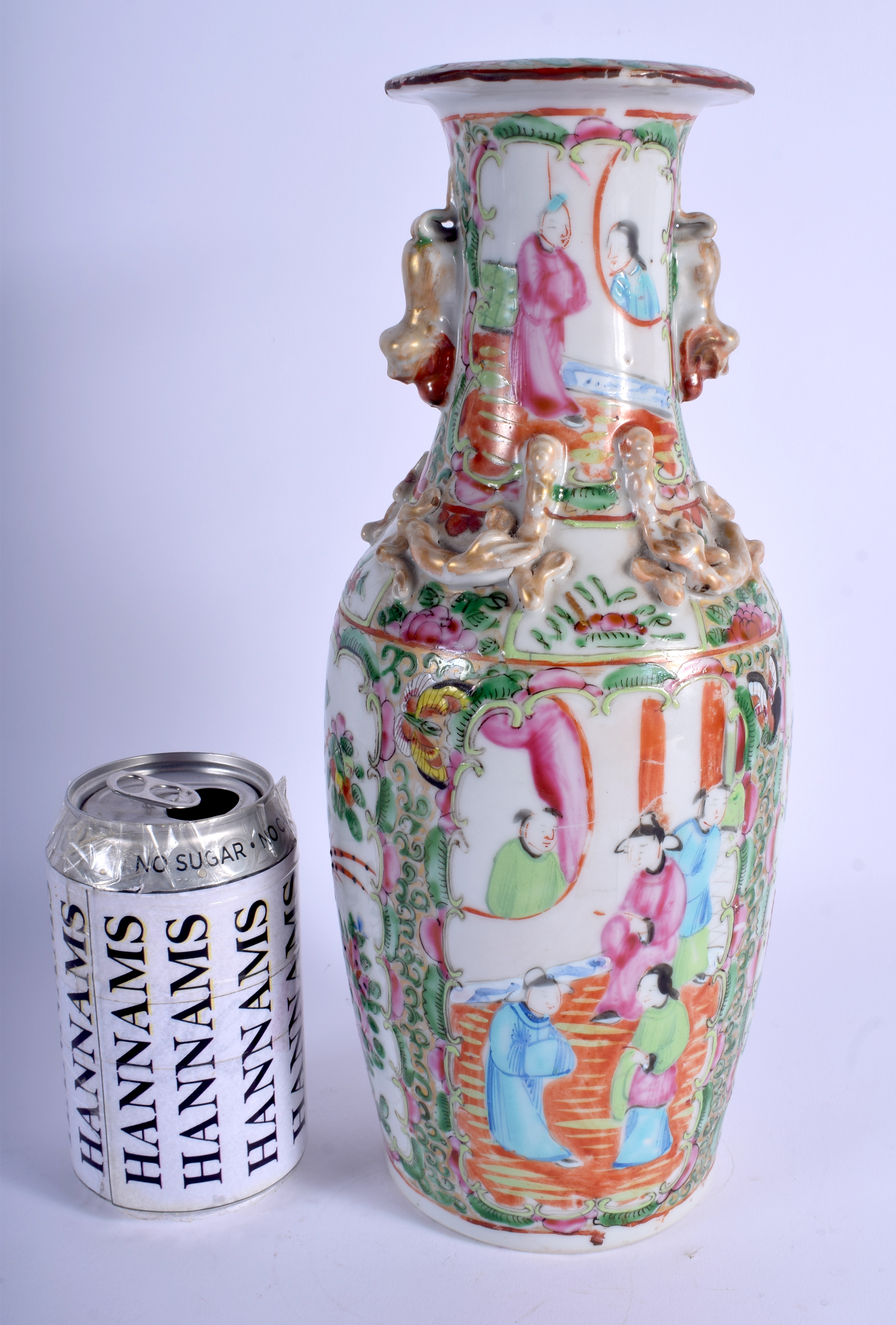 A 19TH CENTURY CHINESE CANTON FAMILLE ROSE VASE Qing, painted with figures and foliage. 31 cm high.