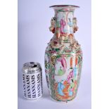 A 19TH CENTURY CHINESE CANTON FAMILLE ROSE VASE Qing, painted with figures and foliage. 31 cm high.