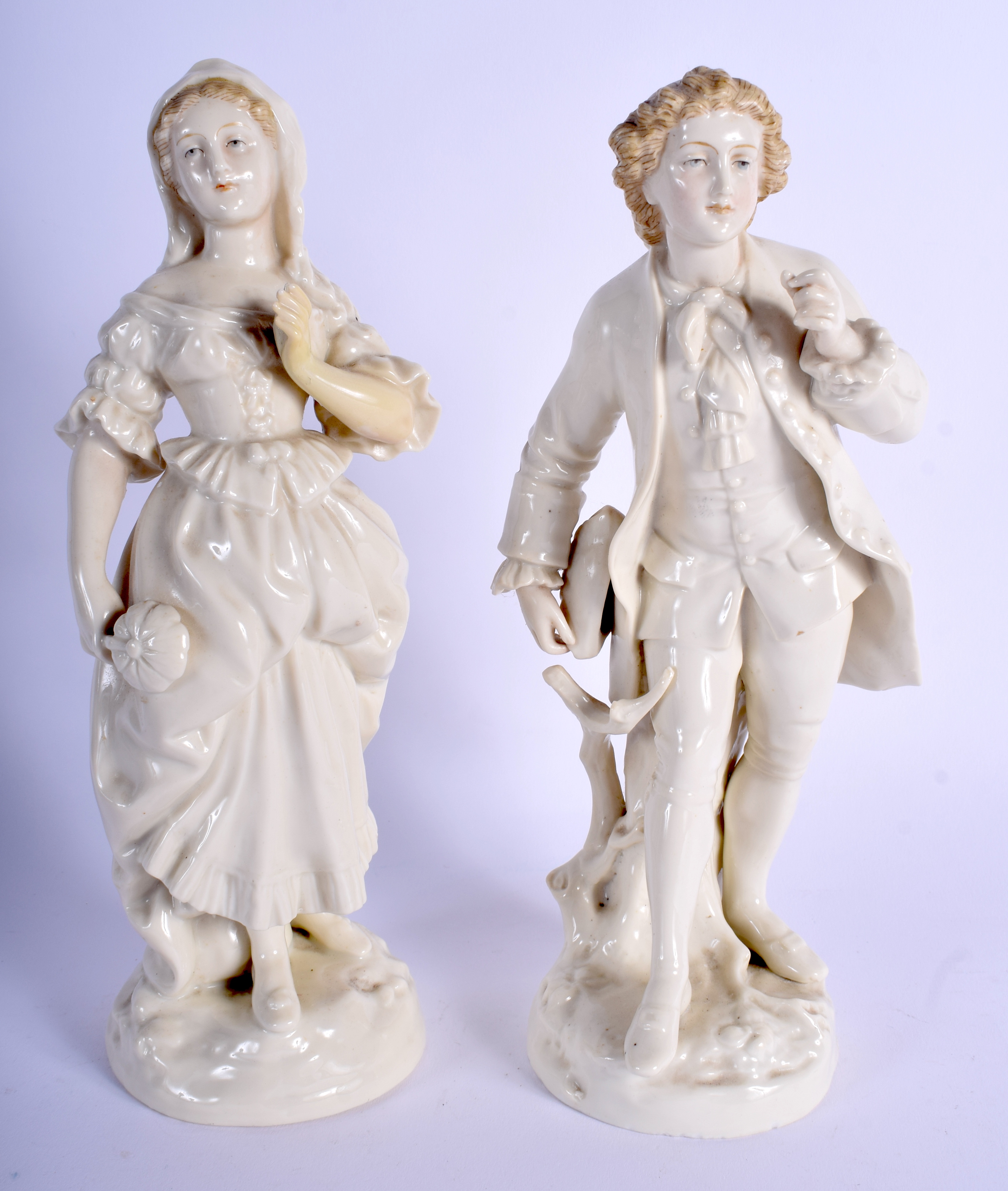 A PAIR OF 19TH CENTURY CONTINENTAL PORCELAIN FIGURES possibly German or Austrian. 22 cm high.